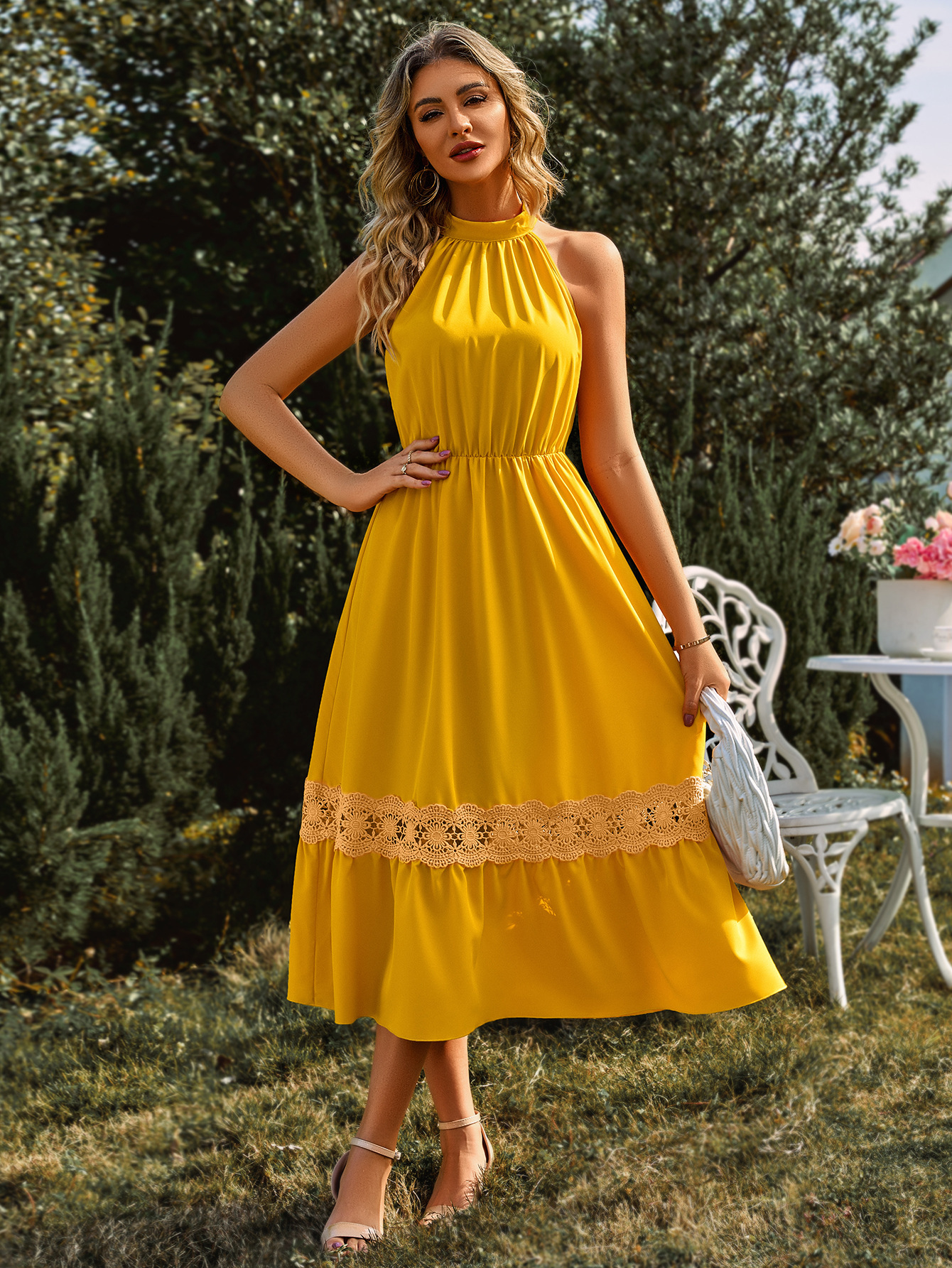 Sleeveless halterneck lace dress